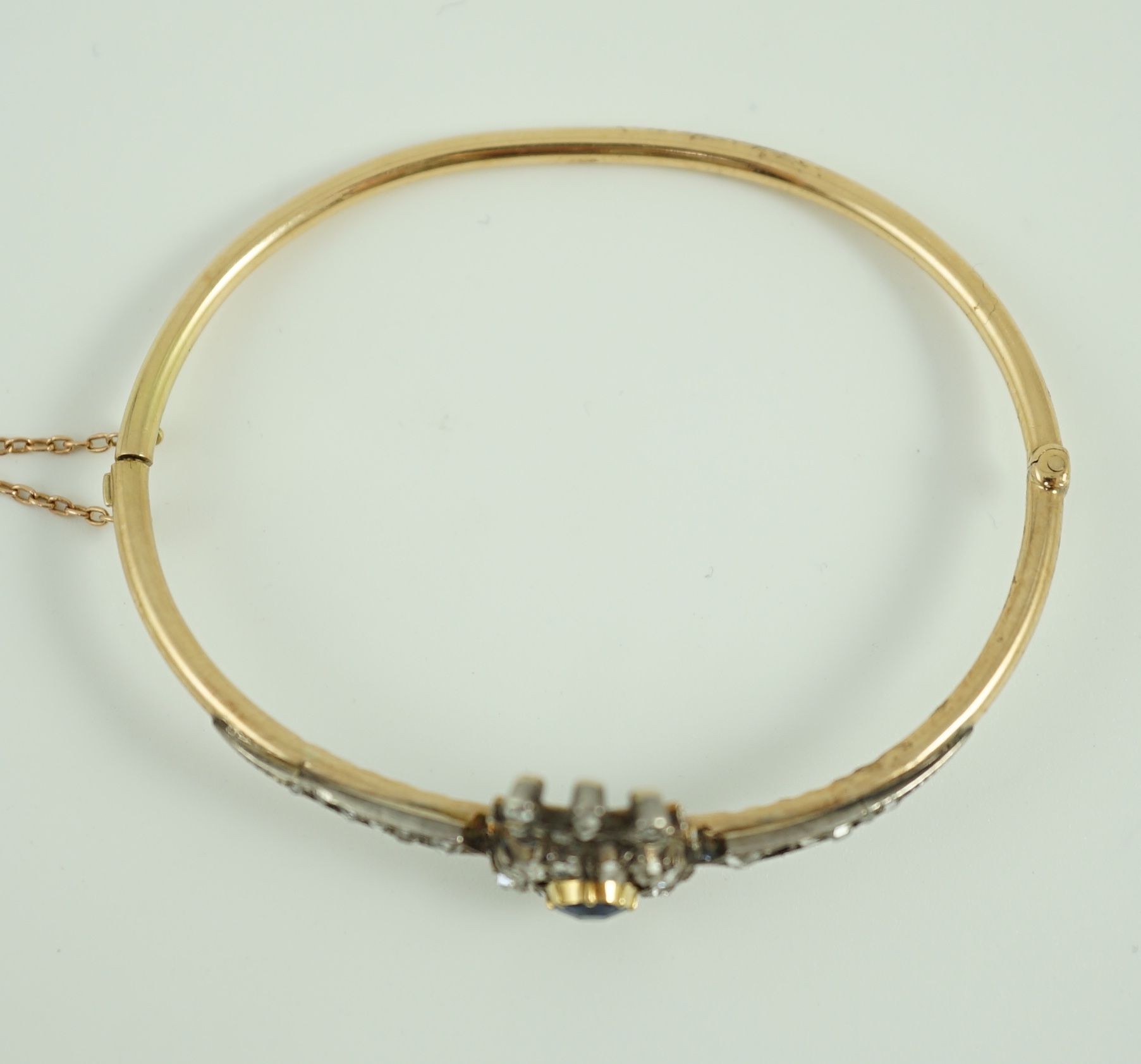 A 19th century gold, sapphire and rose cut diamond set hinged bangle